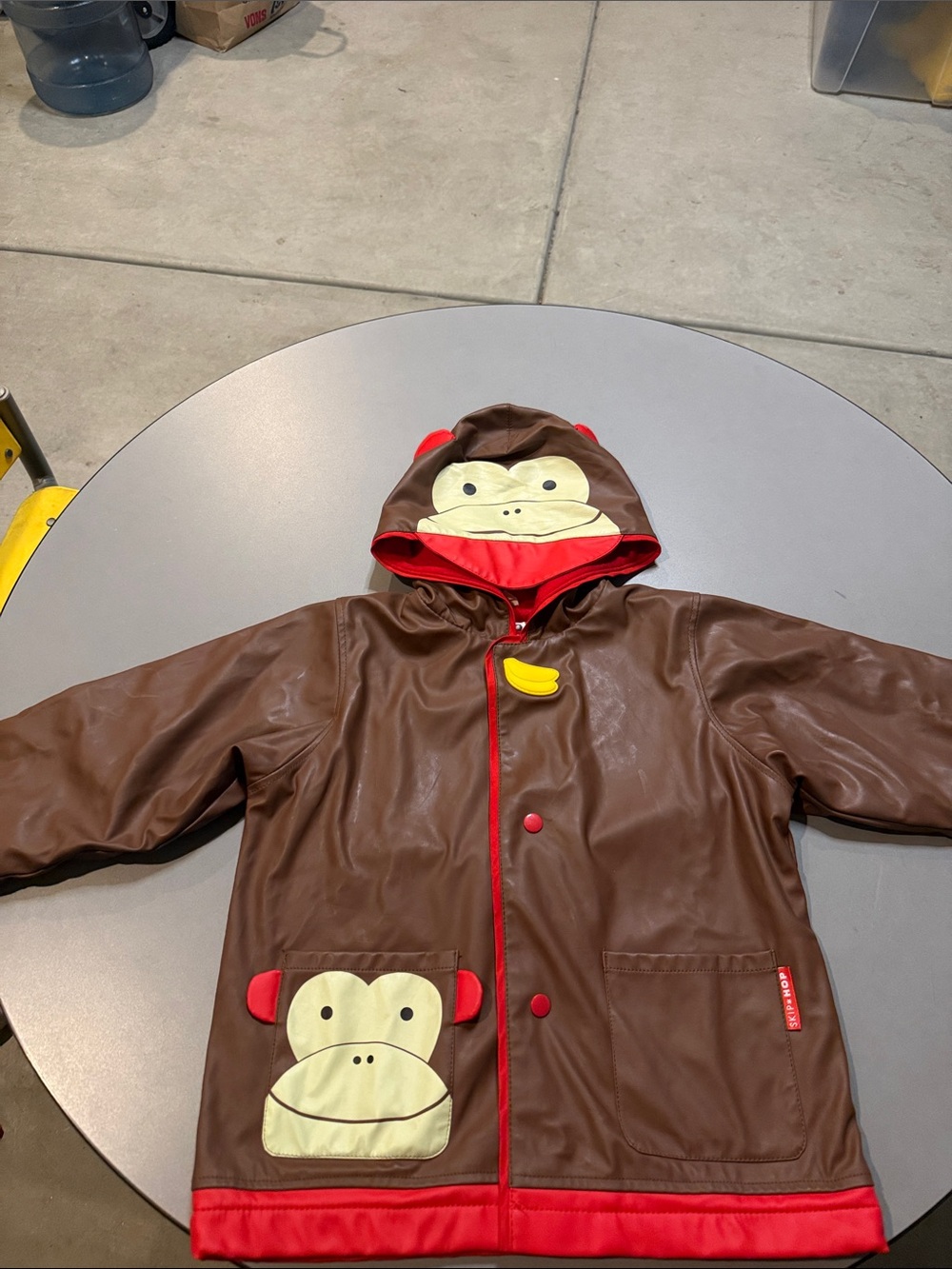 Skip Hop Brown Monkey Raincoat with Red Trim and Yellow Banana Accent